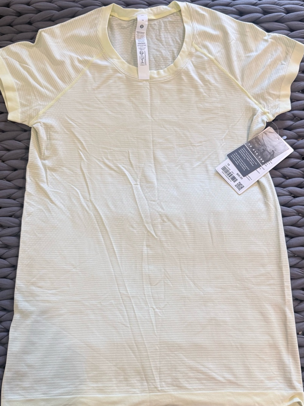 Lululemon Swiftly Tech hip length. Size 10. NWT. Light yellow
